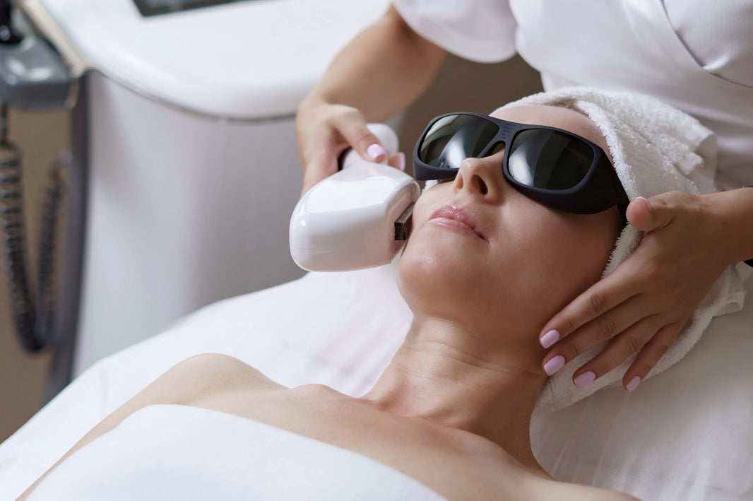 Microneedling vs laser resurfacing treatment - woman receiving laser resurfacing procedure
